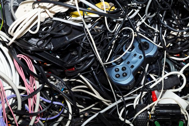 A pile of old wires and electronic equipment.